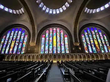 Left window devoted th Saint Raphael, center window to Saint Odile, right window to Saint Michael (Double or triple-click for enlargement)