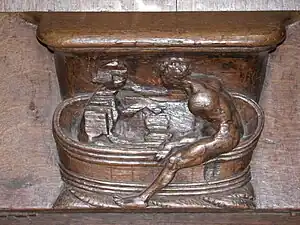 carved bathing scene on a choir stall