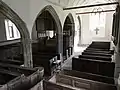 The interior of St Petrock's from the back of the south aisle