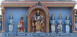 The five Vrishni heroes standing in the Parthasarathy Temple, Eastern Torana Entrance. From left to right: Balarama, Rukmini, Vasudeva-Krishna (center), Pradyumna, Aniruddha and Satyaki