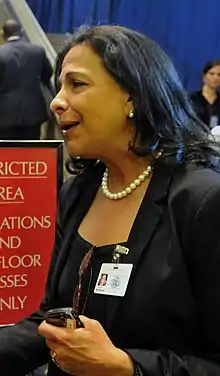 Profile portrait of Patricia Rodas from the chest upwards wearing a black suit