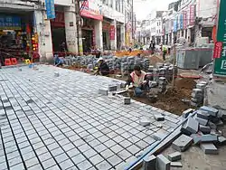 Image 12Replacing the old road with cobblestones of cement in Bo'ao Road area, Haikou City, Hainan, China. (from Roadworks)