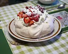 Image 5Pavlova, a popular New Zealand dessert, garnished with cream and strawberries. (from Culture of New Zealand)