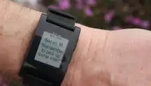 A smartwatch displaying an email message