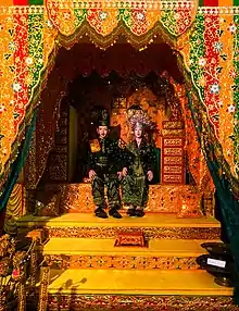 Replica of a traditional wedding dais that incorporated the Malay tricolour.