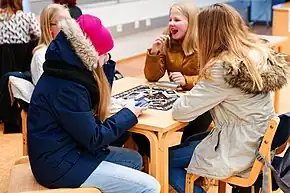 Image 29Young girls playing a board game in the Iisalmi, Finland, library in 2016 (from Board game)