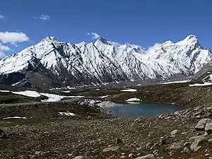 View of Glacial lake and the Drang Drung Glacier, as seen from Pensi La, Zanskar, Ladakh, India.