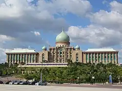 Large building with a series of flags in front of it