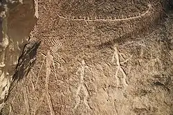 Petroglyphs of people and things