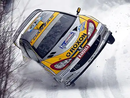 Image 14Swedish RallyPhoto credit: Christopher BattJuuso Pykälistö, driving a Peugeot 206 WRC at the 2003 Swedish Rally, lands a high-speed "yump" on two wheels in the snow. This rally competition is part of the World Rally Championship and was the first rally to be held on snow.More selected pictures