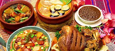 A variety of Filipino food, including kare-kare, pinakbet, dinuguan, and crispy pata