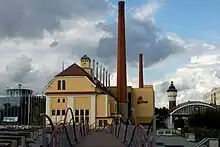 Image 10Traditional fermenting building (center) and modern fermenting building (left) in Pilsner Urquell Brewery (Czech Republic) (from History of beer)