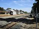 Several railway tracks, with small platform on the right