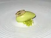 Pistachio ice cream over whipped mascarpone topped with pistachio biscotti