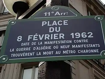 Street sign unveiled at the dedication of the square