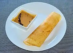 Peanut chutney (top) with a dosa