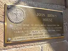 A plaque in front of the building was updated by the Rhode Island Black Heritage Society to reflect John Brown's involvement in the slave trade