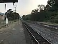 Station platform and track looking in the direction of Haruda. Note the disused platform and former track bed to the right. The siding can be seen to the left.