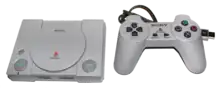 A PlayStation Classic console and controller against a pure white background.