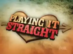 A title card for the American television series Playing It Straight, featuring brown and red letters on a wooden heart that is floating on the ocean shore.