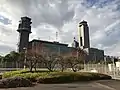 Transplanted plum trees and former ATC tower (left)