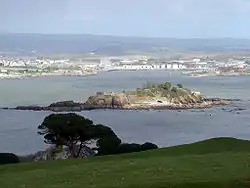 Image 80Northeastward view of Plymouth Sound from Mount Edgcumbe Country Park in Cornwall, with Drake's Island (centre) and, behind it from left to right, the Royal Citadel, the fuel tanks of Cattedown, and Mount Batten; in the background, the hills of Dartmoor. (from Plymouth)