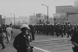 Long line of police greeting long line of protesters