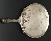 Silver mirror with Hercules-club handle similar to the one found in the House of the Greek Epigrams