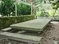 Granite table in the garden under the pergola. The stone may come from a rock on Tambo Island