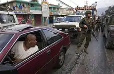 Image 30U.S. Marines patrol the streets of Port-au-Prince on 9 March 2004 (from History of Haiti)