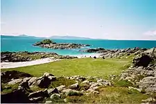 Port nam Murrach beach and duneland at the extreme west end of the peninsula. Looking westwards towards Eigg.