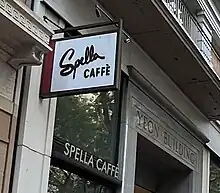 Photograph of a sign on the exterior of a building