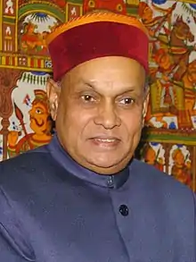 Prem Kumar Dhumal in Himachali cap.