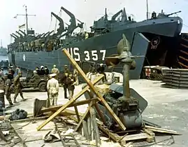 WC-54 being backed into an LST at the start of Operation Overlord.