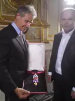 The recreated great Golden Fleece of King Louis XV of France, presented by H. Horovitz (left) and François Farges [fr] (right) at the Hôtel de la Marine, formerly the royal Storehouse in Paris, on June 30, 2010