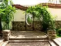 Pergola with roses in the garden