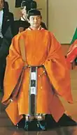 The Crown Prince of Japan wear orange Sokutai.