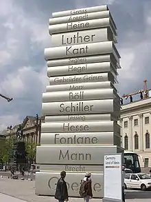 Image 1912-metre-high (40 ft) stack of books sculpture at the Berlin Walk of Ideas, commemorating the invention of modern book printing (from History of books)