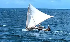 Carolinian single-outrigger shunting wa with a "crane sprit" crab claw sail on a canted mast