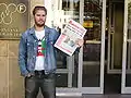 A man holding a Proletären newspaper in 2005