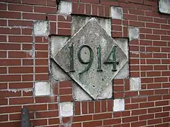 Tile on the tunnel's west portal marks year of opening