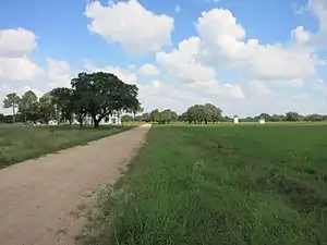 A north-looking view of the area shows the old hotel behind the oak tree at left.