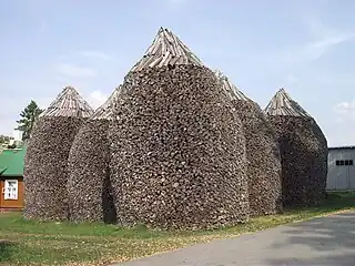 Firewood stacks at Pühtitsa Convent in Estonia are about 6 meters high.