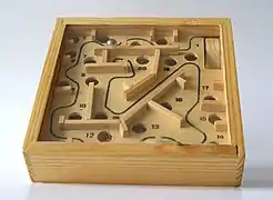 Image 11A ball-in-a-maze puzzle requires fine motor skills (from Game of skill)