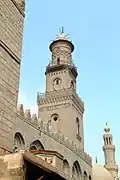 The minaret of Sultan Qalawun's complex, originally built in 1285. The third level was rebuilt in brick by his son in 1303. The conical cap is from Ottoman repairs centuries later.