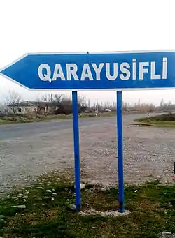 Sign at the entrance of the village