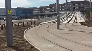 The eastern ramp and tram stop seen from street level