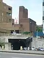 The Dock entrance to the Queensway Tunnel, with the brick New Quay Ventilation Station in the centre of the picture(1925–31; Grade II)