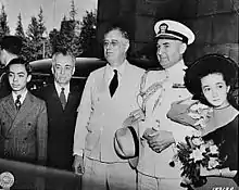 Quezon, two family members, Franklin D. Roosevelt and a U.S. military officer