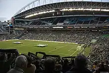 A view of a soccer field from high in the crowd before a match